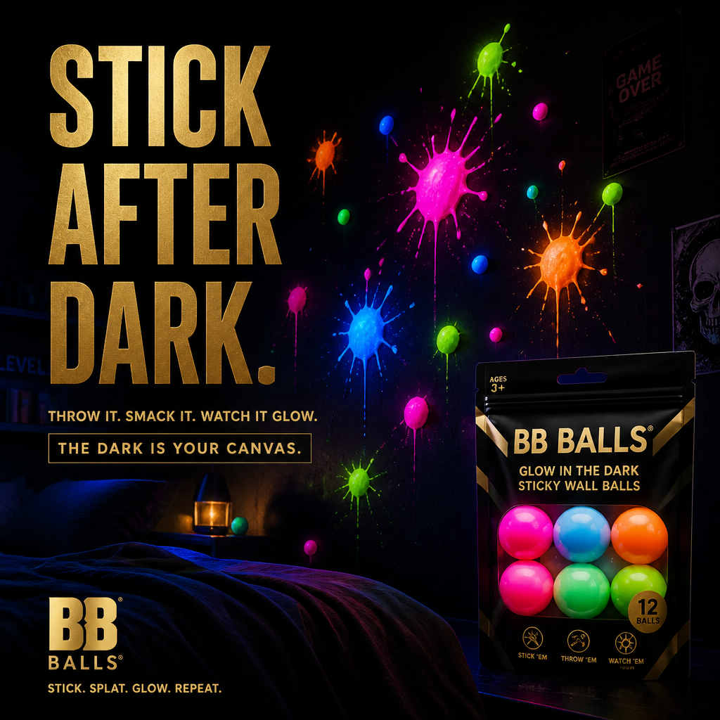 BB Balls glow-in-the-dark sticky wall balls glowing neon on a dark wall — brand lifestyle shot